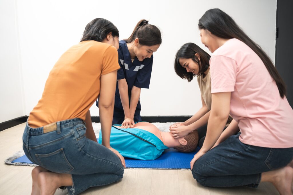 CPR Training ,Emergency and first aid class on cpr doll, Cardiopulmonary resuscitation